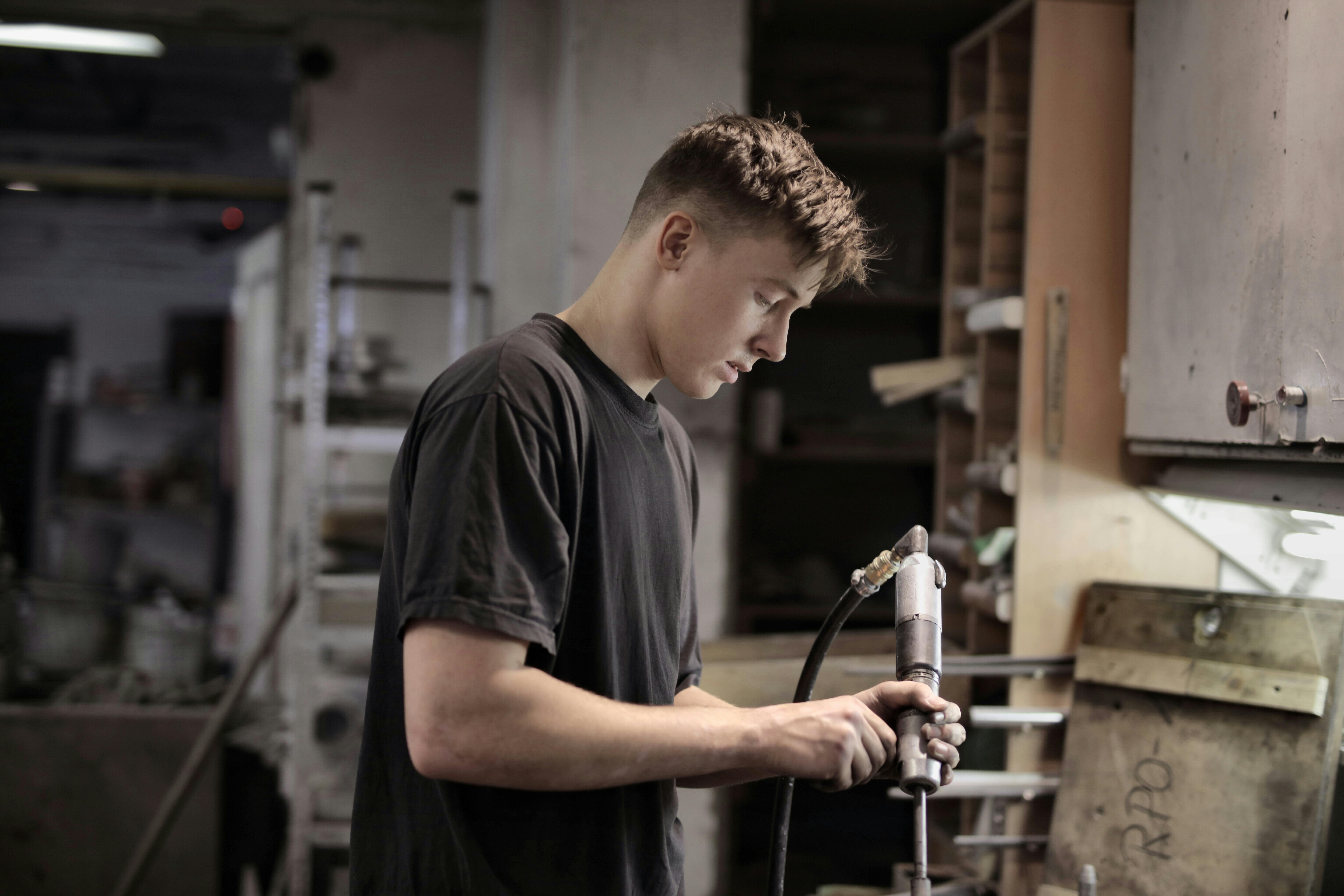 young man working in mechanics young man working in mechanics
